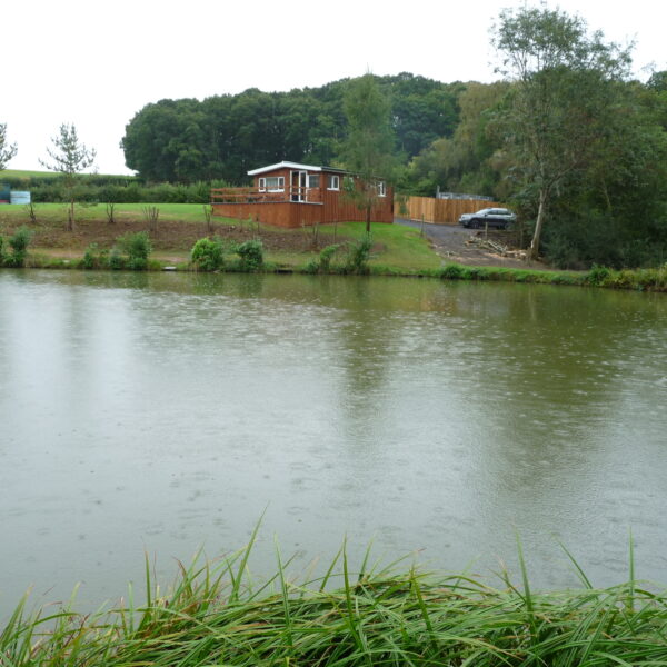 Looking across to the holiday lodge at Furnace Mill Fishery in Worcestershire