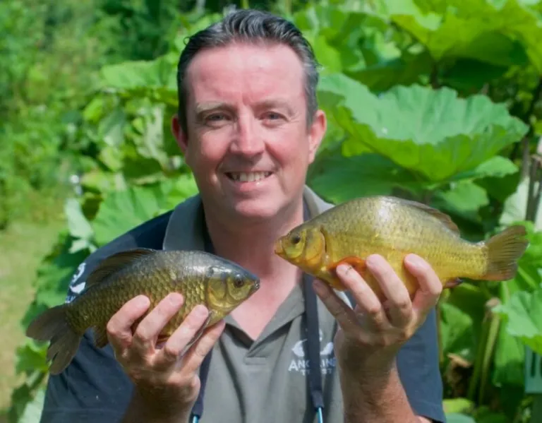 John Cheyne with two nice Crucian Carp.