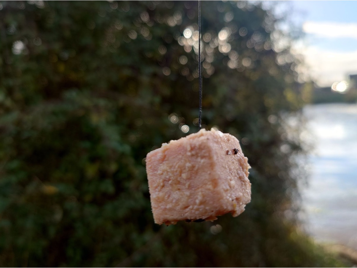 Salted luncheon meat secured with a blade of grass is all you need.