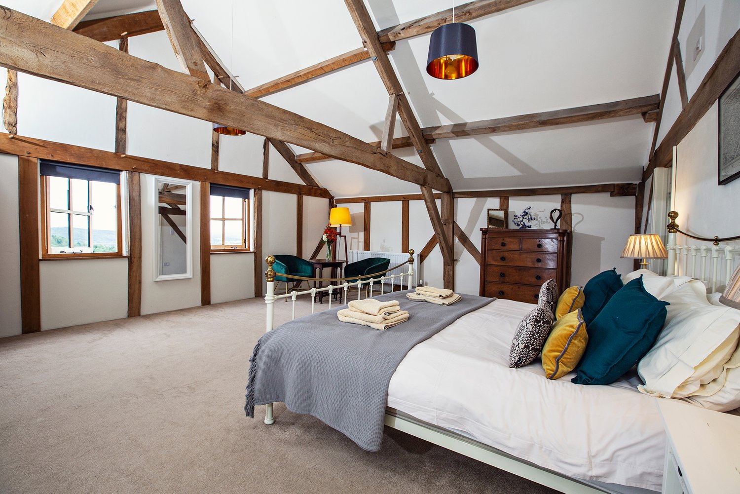 A bedroom in the South Barn at Cwm Pelved holiday retreat with fishing available on the nearby River Wye